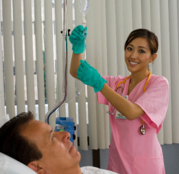 nurse checking IV bag