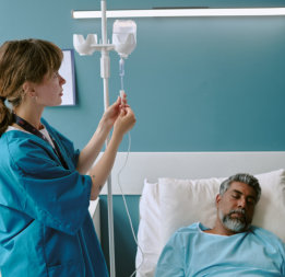 nurse checking IV bag