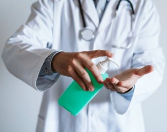 doctor using disinfectant