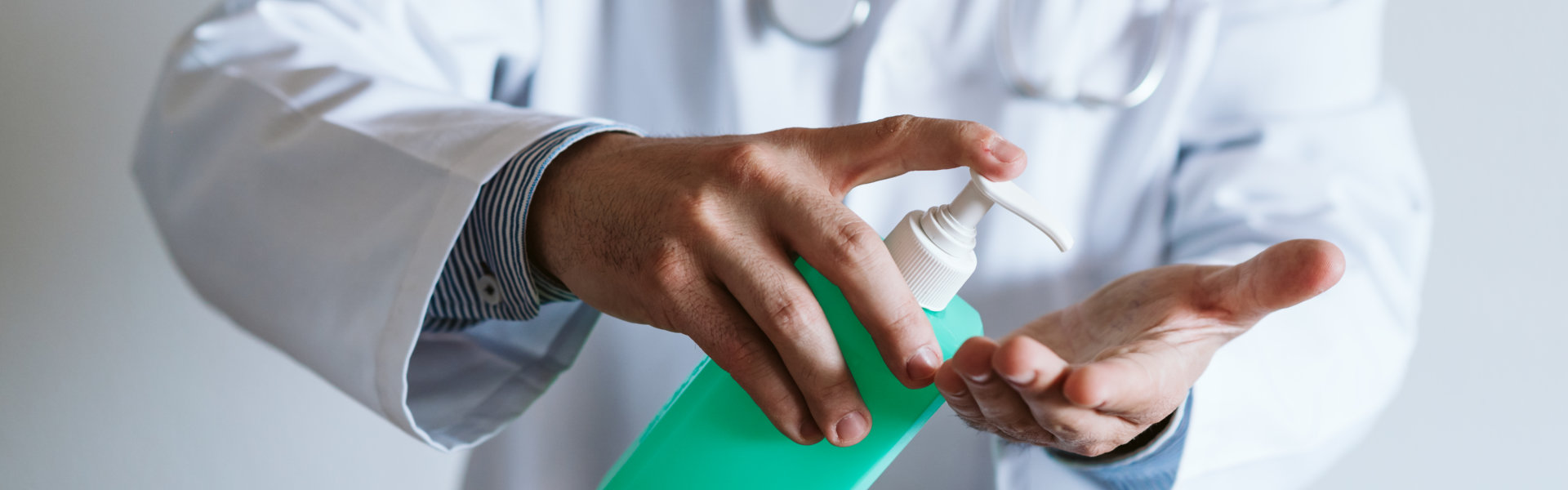 doctor using disinfectant