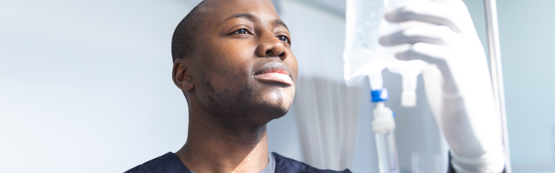 nurse checking IV bag