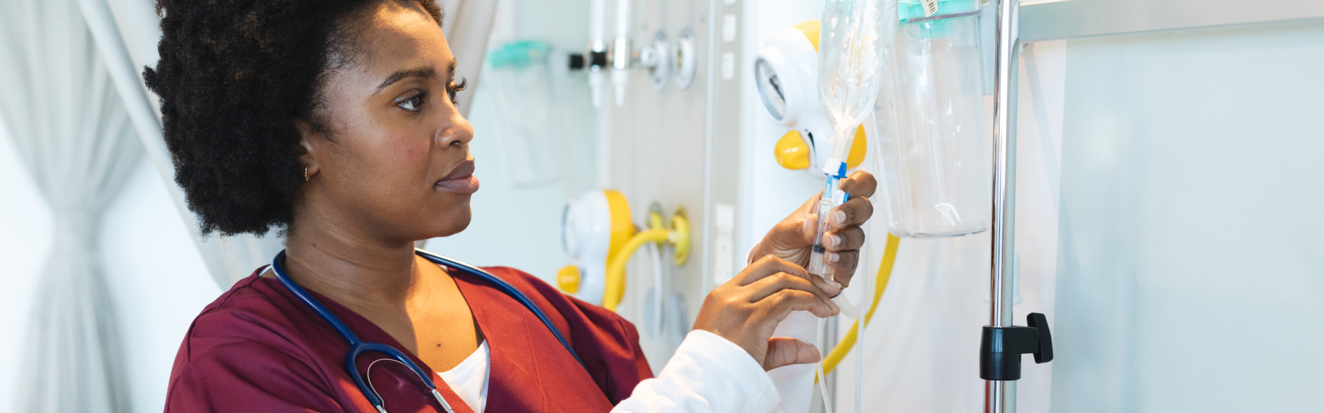 nurse checking IV bag